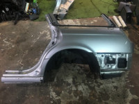 Guarda-lamas traseiro esquerdo 51472AE230 SUBARU LEGACY