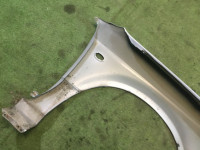 Guarda-lamas dianteiro esquerdo SUBARU LEGACY OEM 57120AE011 BH5 2001 Silver 01G