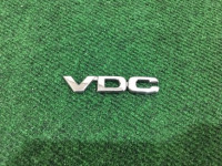 โลโก้ VDC SUBARU LANCASTER OEM 93073AE690 BHE 2000 white / grey 0U4