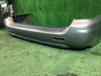Parachoques trasero SUBARU LANCASTER OEM 57703AE080LG BHE BH9 2000 silver 9G9