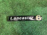 โลโก้ LANCASTER 6 SUBARU LANCASTER OEM 93073AE650 BH9 2001 BLUE / GREY 1U3